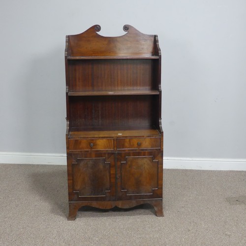 564 - A regency style mahogany open waterfall Bookcase, the scrolled pediment over shelves, drawers and cu... 