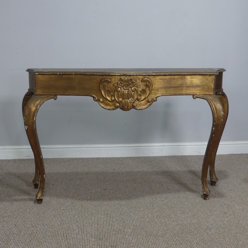 568 - A 19th century inspired gilt painted side / console Table, the shaped top over carved foliate frieze... 