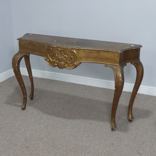 568 - A 19th century inspired gilt painted side / console Table, the shaped top over carved foliate frieze... 