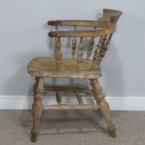 547 - An early 20th century ash and elm smokers bow Armchair, raised on turned supports, W 63.5 cm x H 80 ... 