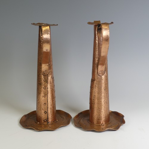 515 - A pair of Arts and Crafts copper Candlesticks, probably by Eustace Brothers, each having a pair of s... 