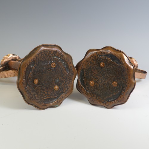 515 - A pair of Arts and Crafts copper Candlesticks, probably by Eustace Brothers, each having a pair of s... 