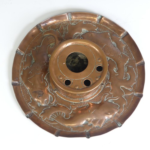 535 - An Arts and Crafts Cornish copper Inkwell, in the manner of Newlyn, the circular dish repousse decor... 