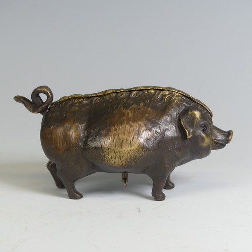 553 - An early 20th century brass butchers countertop Bell, in the form of a pig, inset with glass eyes an... 