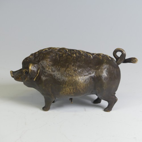 553 - An early 20th century brass butchers countertop Bell, in the form of a pig, inset with glass eyes an... 