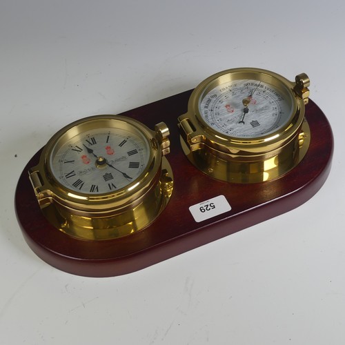 529 - A Sewills of Liverpool brass cased Marine / Ship's Clock and Barometer, both mounted on a single mah... 