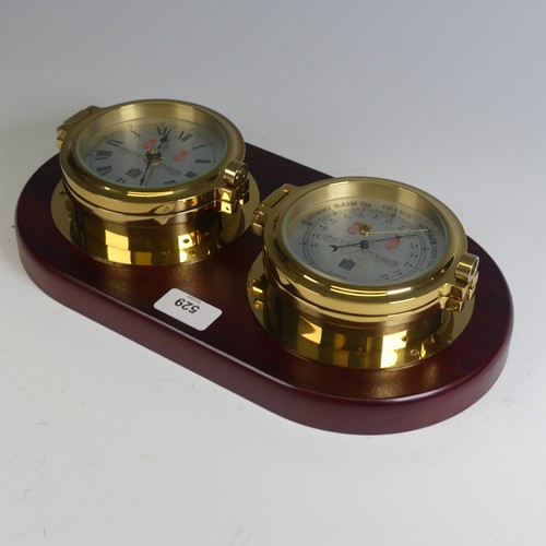 529 - A Sewills of Liverpool brass cased Marine / Ship's Clock and Barometer, both mounted on a single mah... 