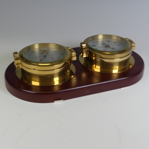 529 - A Sewills of Liverpool brass cased Marine / Ship's Clock and Barometer, both mounted on a single mah... 