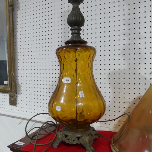 549 - An antique amber glass table Lamp, of bulbous form, raised on brass base, H 90 cm.