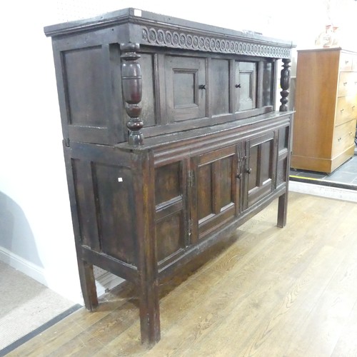 537 - A 17th century carved oak court Cupboard, the cornice with carved details and 'WBEB' raised on bulbo... 