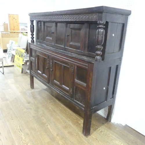 537 - A 17th century carved oak court Cupboard, the cornice with carved details and 'WBEB' raised on bulbo... 