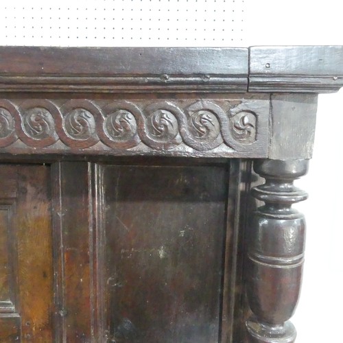 537 - A 17th century carved oak court Cupboard, the cornice with carved details and 'WBEB' raised on bulbo... 