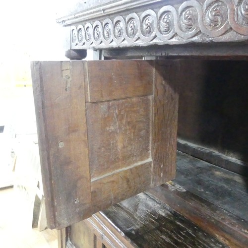 537 - A 17th century carved oak court Cupboard, the cornice with carved details and 'WBEB' raised on bulbo... 