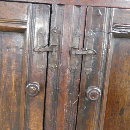 537 - A 17th century carved oak court Cupboard, the cornice with carved details and 'WBEB' raised on bulbo... 