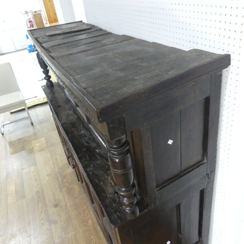 537 - A 17th century carved oak court Cupboard, the cornice with carved details and 'WBEB' raised on bulbo... 