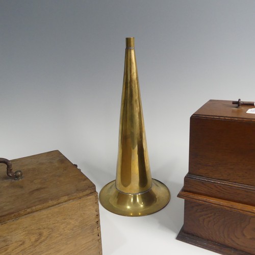 284 - An early 20th century wax cylinder Phonograph, with reproducer and brass horn, in oak case, together... 