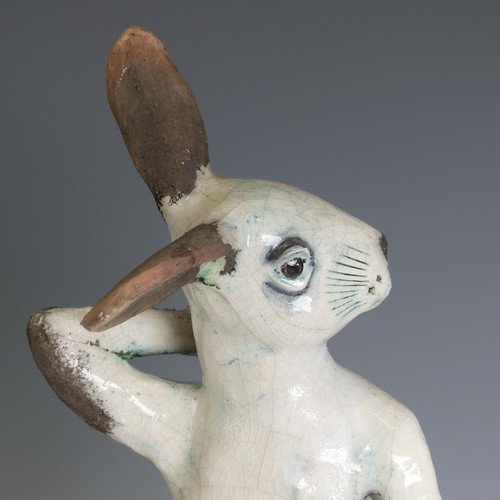 364 - Lawson E. Rudge (b. 1936), a raku fired studio pottery sculpture of a Hare, modelled sitting upright... 