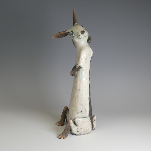 364 - Lawson E. Rudge (b. 1936), a raku fired studio pottery sculpture of a Hare, modelled sitting upright... 