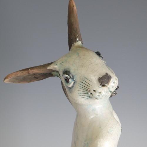 364 - Lawson E. Rudge (b. 1936), a raku fired studio pottery sculpture of a Hare, modelled sitting upright... 