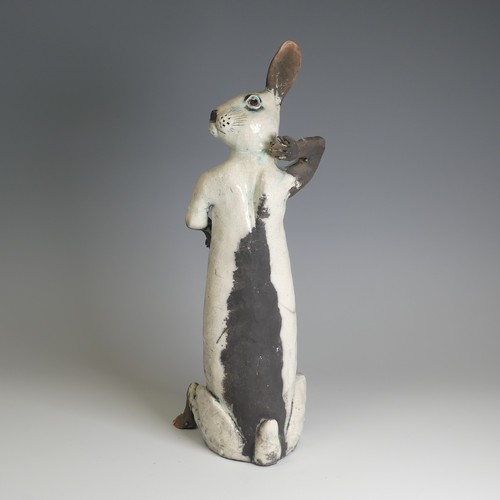 364 - Lawson E. Rudge (b. 1936), a raku fired studio pottery sculpture of a Hare, modelled sitting upright... 