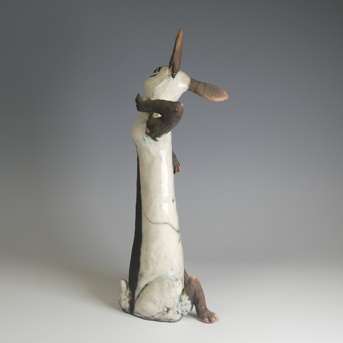 364 - Lawson E. Rudge (b. 1936), a raku fired studio pottery sculpture of a Hare, modelled sitting upright... 