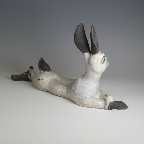 365 - Lawson E. Rudge (b. 1936), a raku fired studio pottery sculpture of a Hare, modelled cross legged, L... 