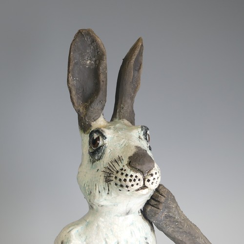 368 - Lawson E. Rudge (b. 1936), a raku fired studio pottery sculpture of a Hare, modelled scratching, H 4... 