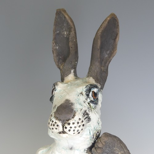 368 - Lawson E. Rudge (b. 1936), a raku fired studio pottery sculpture of a Hare, modelled scratching, H 4... 