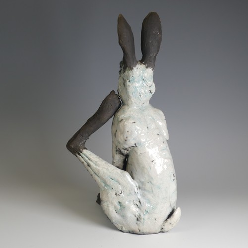 368 - Lawson E. Rudge (b. 1936), a raku fired studio pottery sculpture of a Hare, modelled scratching, H 4... 