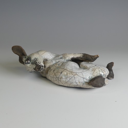 369 - Lawson E. Rudge (b. 1936), a raku fired studio pottery sculpture of a Hare, wall hanging, W 26cm.... 