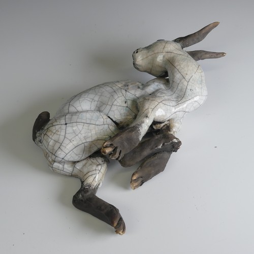 369 - Lawson E. Rudge (b. 1936), a raku fired studio pottery sculpture of a Hare, wall hanging, W 26cm.... 