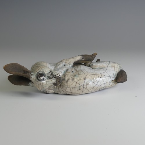 369 - Lawson E. Rudge (b. 1936), a raku fired studio pottery sculpture of a Hare, wall hanging, W 26cm.... 