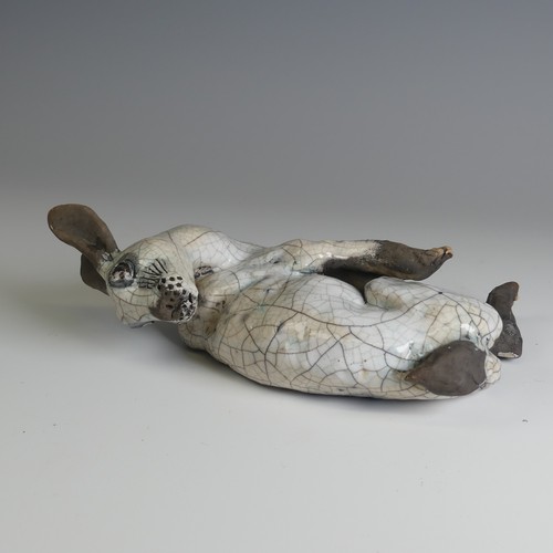 369 - Lawson E. Rudge (b. 1936), a raku fired studio pottery sculpture of a Hare, wall hanging, W 26cm.... 