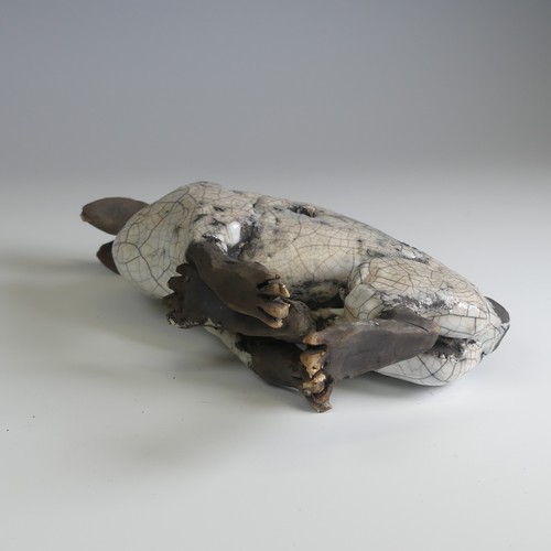 369 - Lawson E. Rudge (b. 1936), a raku fired studio pottery sculpture of a Hare, wall hanging, W 26cm.... 