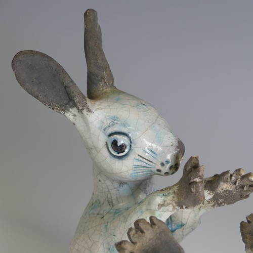 370 - Lawson E. Rudge (b. 1936), a raku fired studio pottery sculpture of a Hare, modelled on its back cur... 