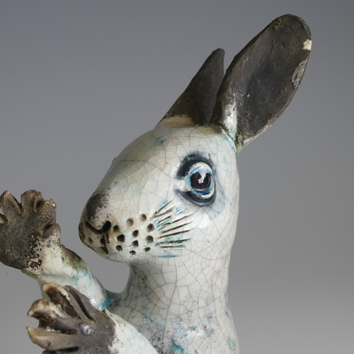 370 - Lawson E. Rudge (b. 1936), a raku fired studio pottery sculpture of a Hare, modelled on its back cur... 