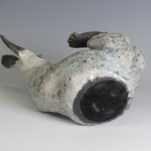 370 - Lawson E. Rudge (b. 1936), a raku fired studio pottery sculpture of a Hare, modelled on its back cur... 