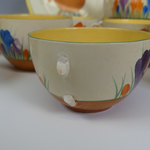 377 - A Clarice Cliff 'Crocus' pattern Tea Set, including; teapot and stand, sugar bowl, creamer jug, six ... 