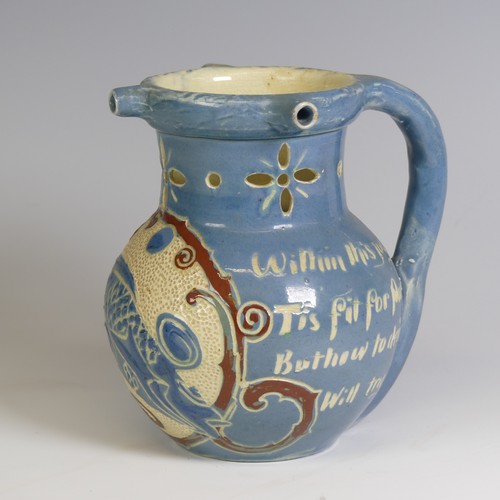 379 - A C. H. Brannam Barum pottery puzzle Jug, decorated with fish and motto, inscribed marks to base 'C.... 