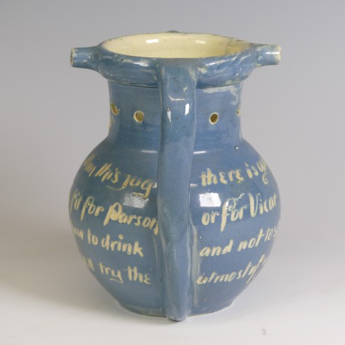 379 - A C. H. Brannam Barum pottery puzzle Jug, decorated with fish and motto, inscribed marks to base 'C.... 