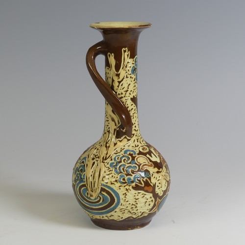 381 - A C. H. Brannam pottery Vase, having a singular swirled handle and decorated with fish, inscribed ma... 