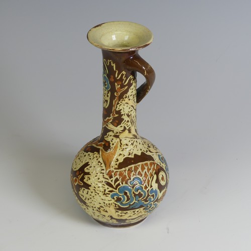 381 - A C. H. Brannam pottery Vase, having a singular swirled handle and decorated with fish, inscribed ma... 