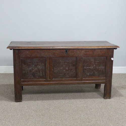 562 - An 18th century oak Coffer, with three carved panels to front and raised on square supports, W 120 c... 