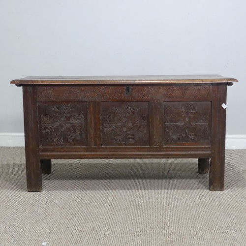 562 - An 18th century oak Coffer, with three carved panels to front and raised on square supports, W 120 c... 