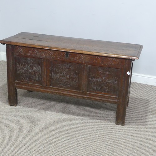 562 - An 18th century oak Coffer, with three carved panels to front and raised on square supports, W 120 c... 