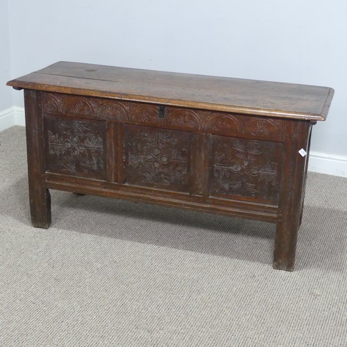 562 - An 18th century oak Coffer, with three carved panels to front and raised on square supports, W 120 c... 