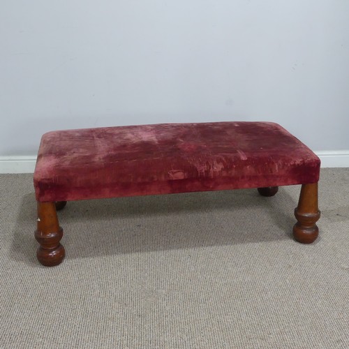 565 - A large antique upholstered Stool, raised on four bulbous turned supports, W 130 cm x H 44 cm x D 68... 