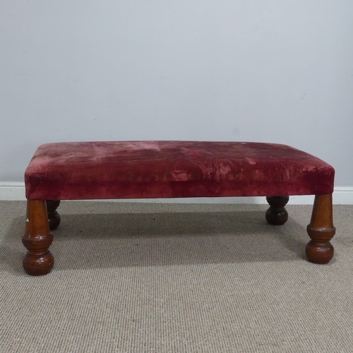 565 - A large antique upholstered Stool, raised on four bulbous turned supports, W 130 cm x H 44 cm x D 68... 