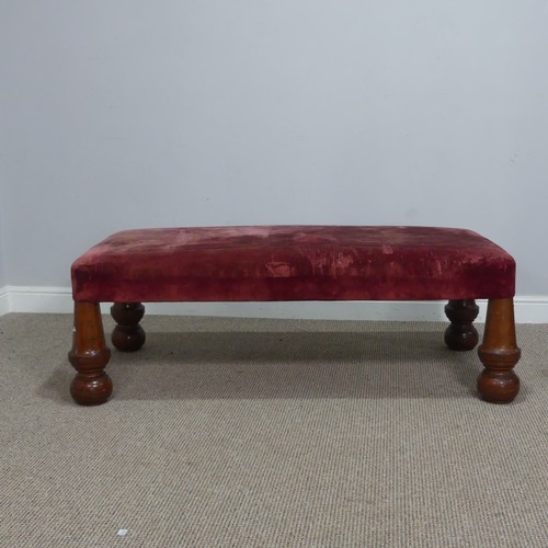 565 - A large antique upholstered Stool, raised on four bulbous turned supports, W 130 cm x H 44 cm x D 68... 