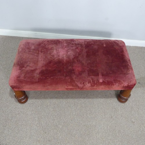 565 - A large antique upholstered Stool, raised on four bulbous turned supports, W 130 cm x H 44 cm x D 68... 